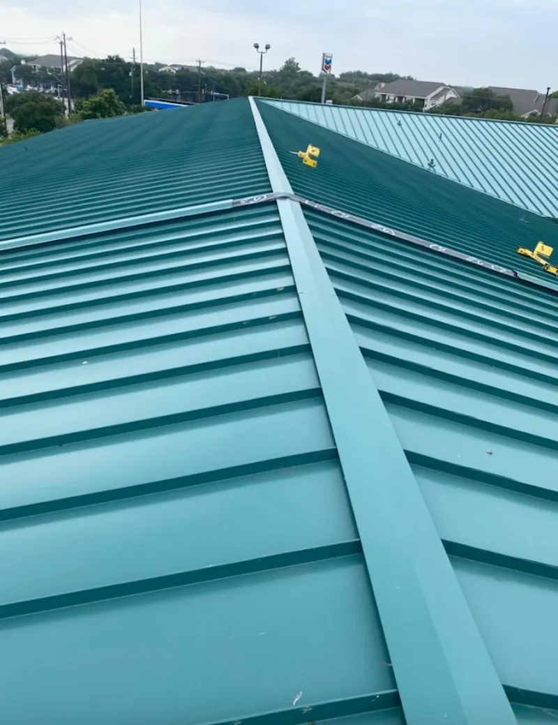 Green commercial metal roof ridge and valley for Metal Roof Repair in Pella