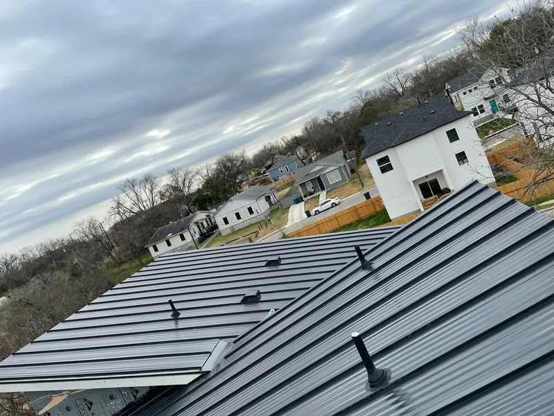 Standing seam metal roof panels with vents for Skylight Repair in Pella